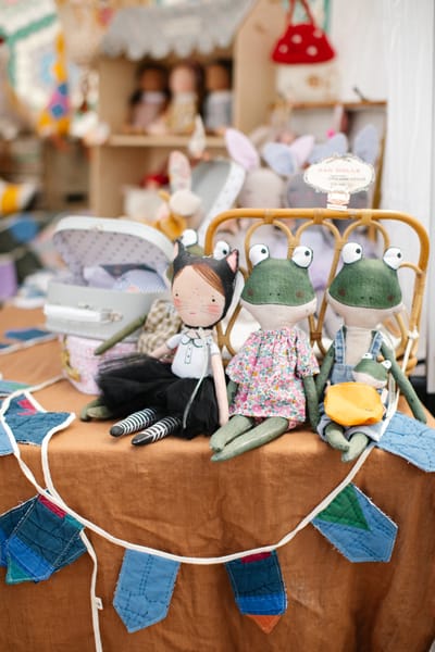 Handmade rag dolls on a rust linen cloth