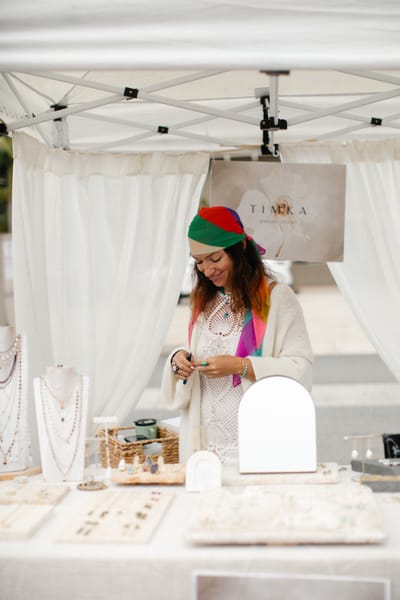 A jewellery booth laid out on linen risers